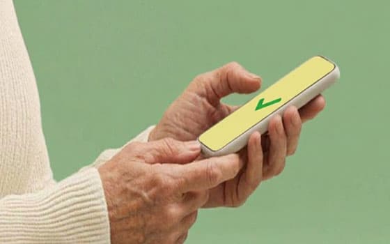 Hands holding smartphone with success screen