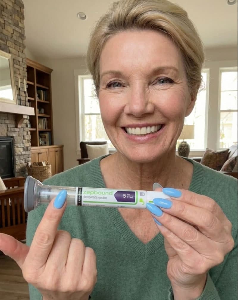 Happy patient holding medication